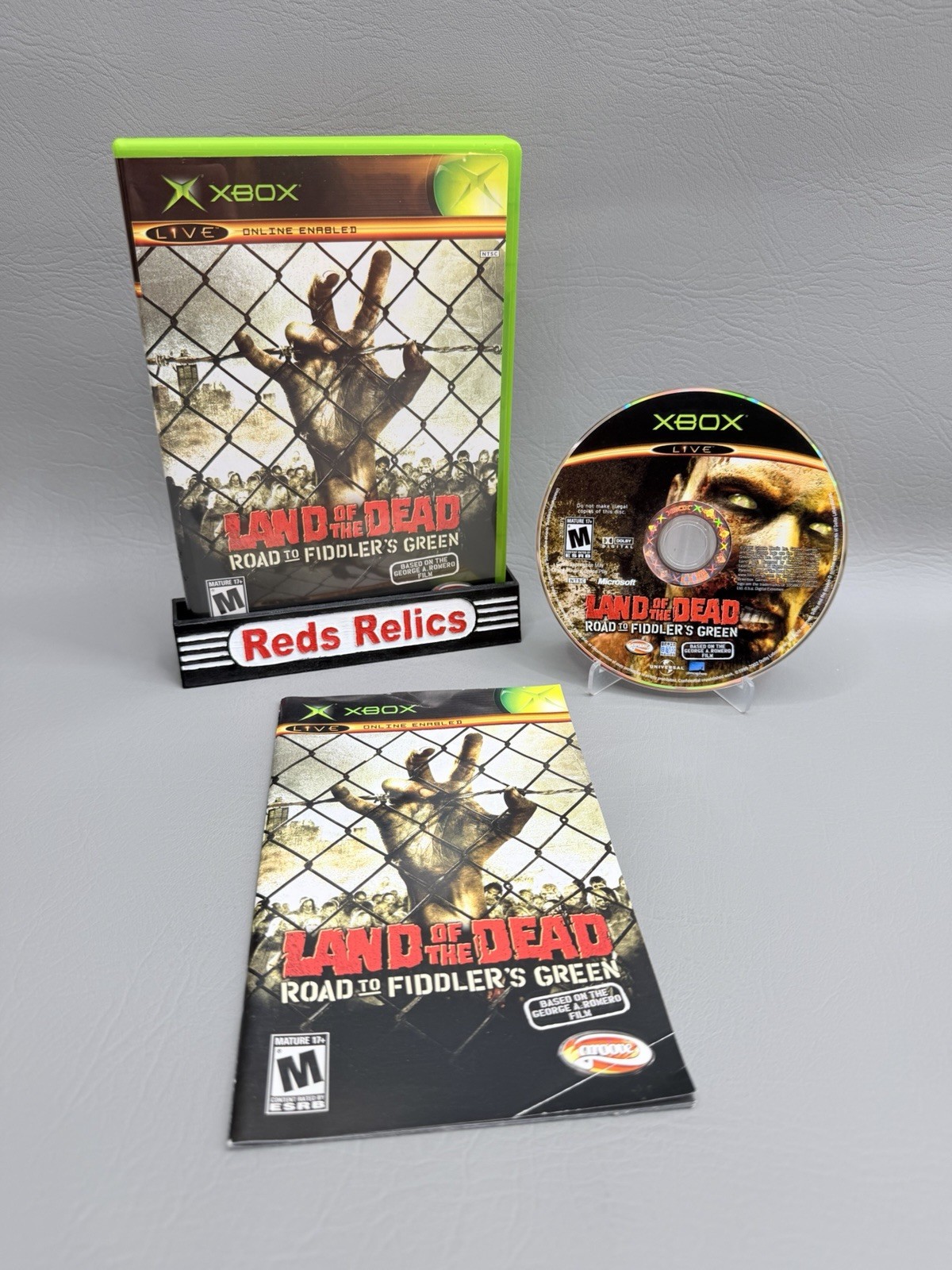 Land of the Dead: Road to Fiddler’s Green Xbox CIB – Pristine Disc – Very Good