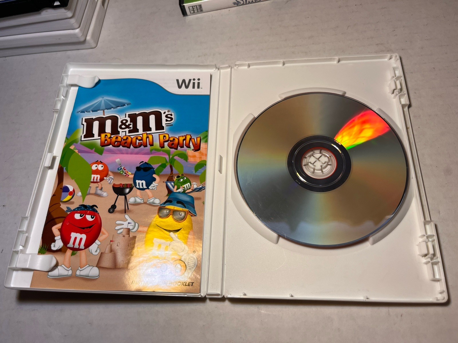 15 Used Wii Games, 2 Aftermarket Controllers Untested
