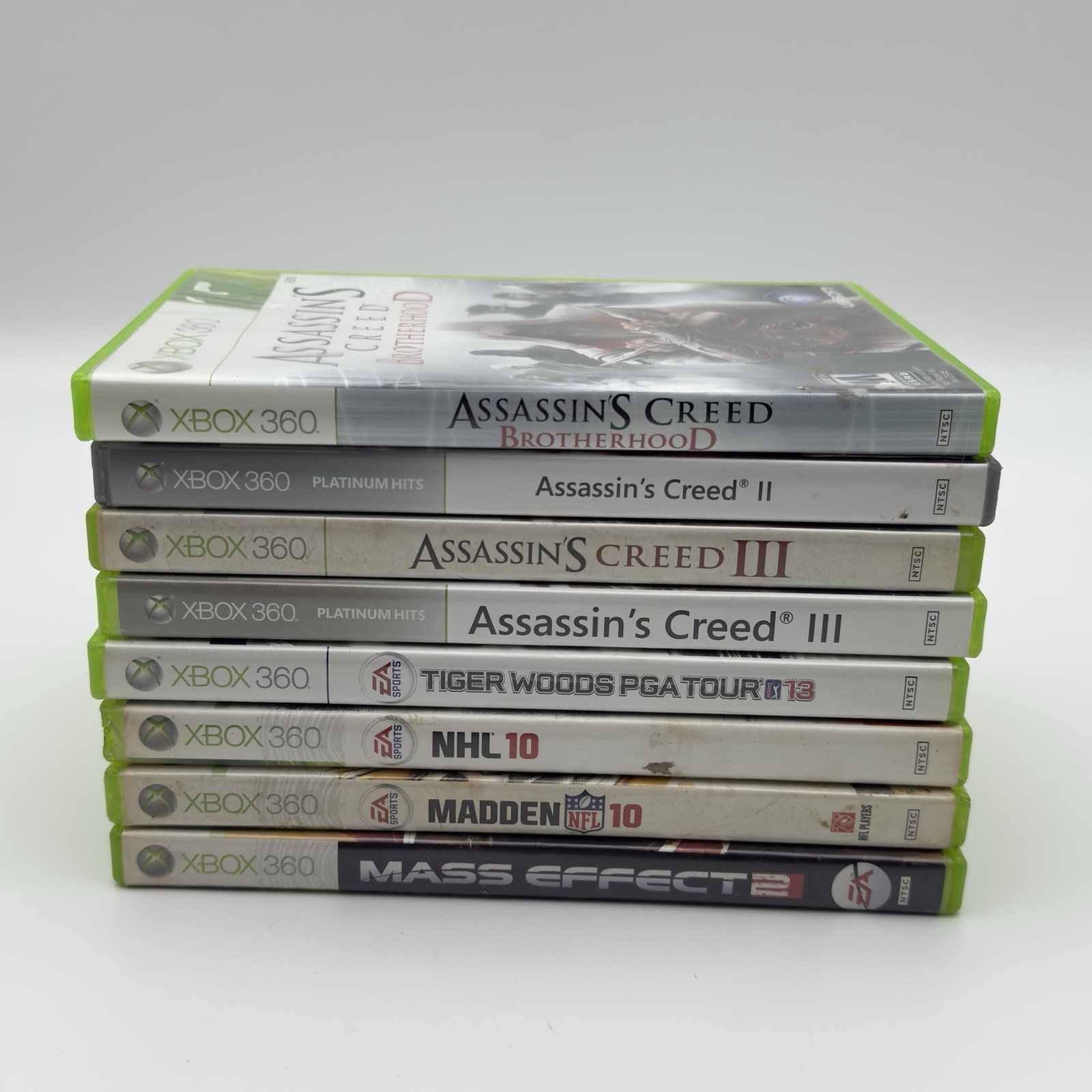 Xbox 360 Game Lot 8 – Assassin’s Creed Series, Mass Effect 2, Sports Titles