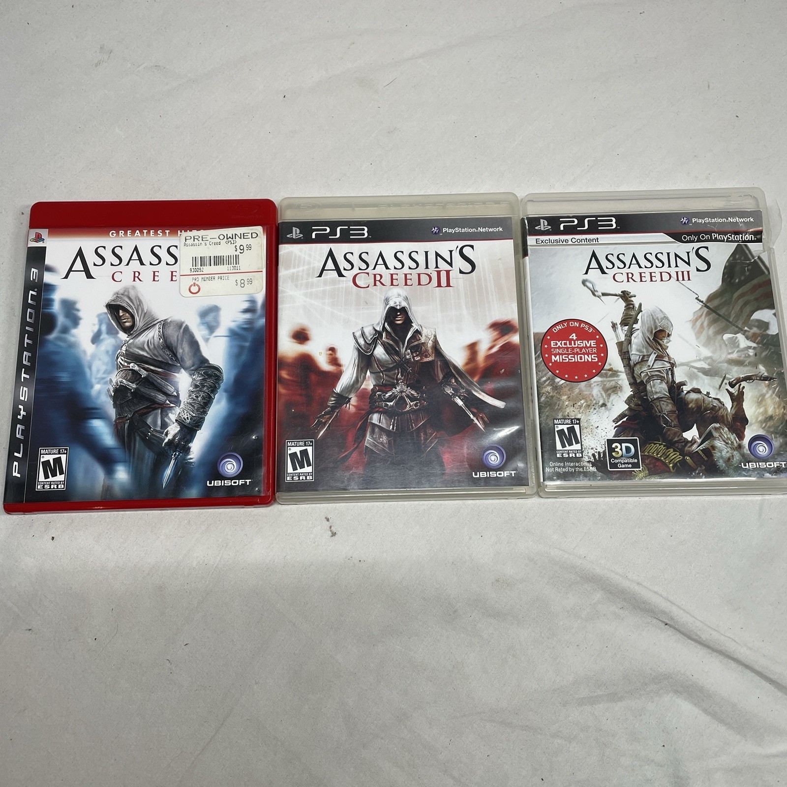 ASSASSIN’S CREED PS3 BUNDLE (ASSASSIN’S CREED 1-3) GAMES AND CASES